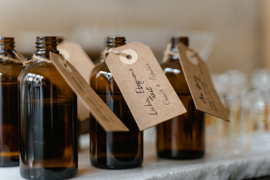 Brown glass bottles with paper tags, ideal for apothecary or decorative use.