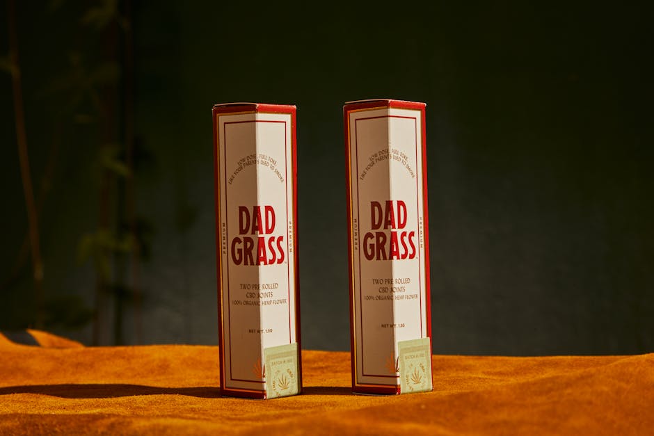 High-quality product shot of Dad Grass CBD packaging with a rustic background.