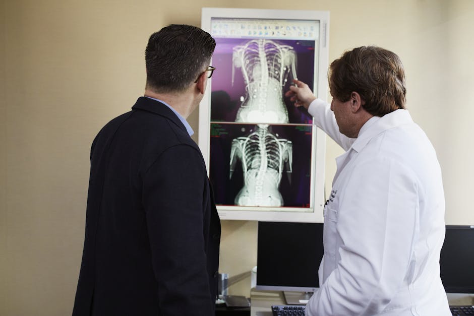 A doctor explains X-ray results to a patient in a clinical setting, highlighting healthcare communication.