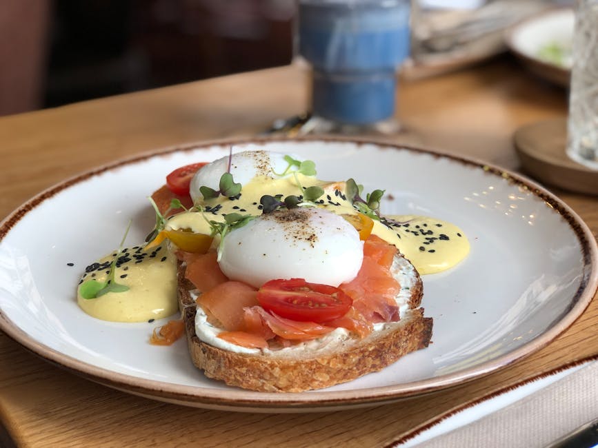 A delicious brunch dish featuring smoked salmon, poached eggs, and hollandaise sauce on toast.