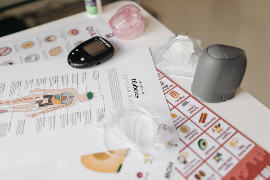 A comprehensive flat lay of diabetes management tools including a glucose meter and instructional flyers.
